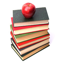 Image showing book stack with apple isolated on white background 