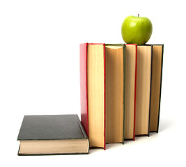 Image showing book stack with apple isolated on white background 