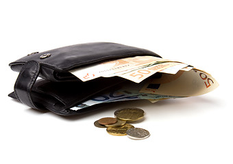 Image showing Money in leather  purse isolated on white  background 