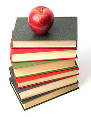 Image showing book stack with apple isolated on white background 