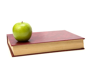 Image showing book with apple isolated on white background 