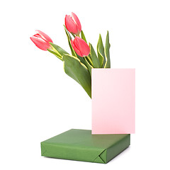 Image showing gift with pink tulips  isolated on white background