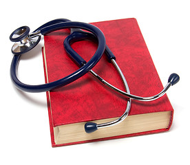 Image showing stethoscope on red book isolated on white background