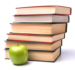 Image showing book stack with apple isolated on white background 