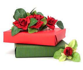 Image showing Gift with floral decor. Flowers are artificial. 