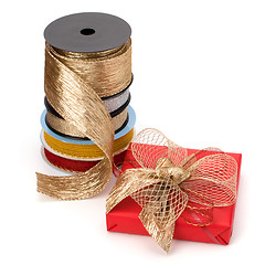 Image showing Festive gift box and wrapping ribbons isolated on white backgrou