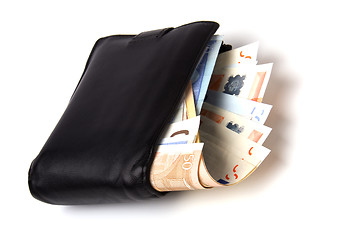 Image showing Money in leather  purse isolated on white  background 