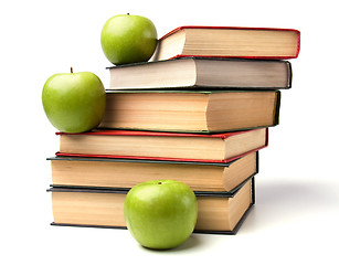 Image showing book stack with apple isolated on white background 