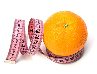 Image showing  tape measure wrapped around the orange isolated on white backgr