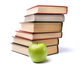 Image showing book stack with apple isolated on white background 