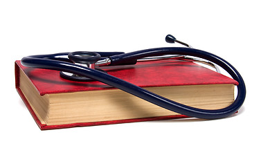 Image showing stethoscope on red book isolated on white background