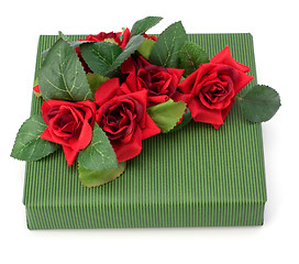 Image showing Gift with floral decor. Flowers are artificial. 