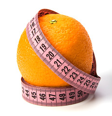 Image showing  tape measure wrapped around the orange isolated on white backgr