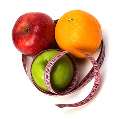 Image showing  tape measure wrapped around fruits isolated on white background