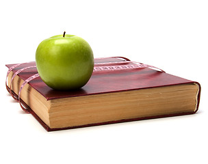 Image showing tape measure wrapped around book isolated on white background