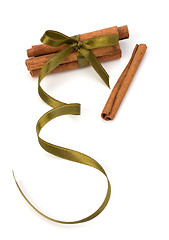 Image showing Festive wrapped cinnamon sticks 