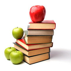 Image showing book stack with apple isolated on white background 