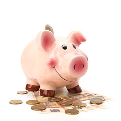 Image showing Business concept. Lucky piggy bank isolated on white background.