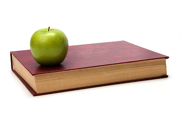 Image showing book with apple isolated on white background 