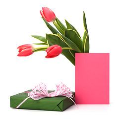 Image showing gift with pink tulips  isolated on white background