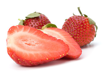 Image showing Halved strawberries isolated on white background