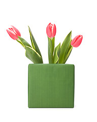 Image showing gift with pink tulips  isolated on white background