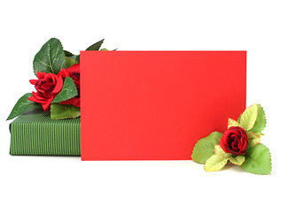 Image showing Gift with floral decor. Flowers are artificial. 