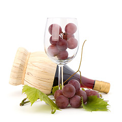 Image showing red wine bottle and glass full with grapes  