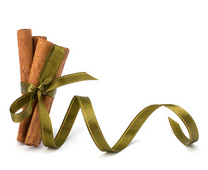 Image showing Festive wrapped cinnamon sticks 