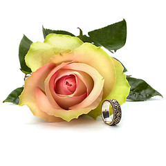 Image showing Beautiful rose with wedding ring  isolated on white background 