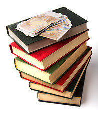 Image showing Money over book stack.  Education  concept