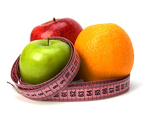 Image showing  tape measure wrapped around fruits isolated on white background