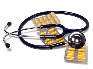 Image showing stethoscope and tablets isolated on white background