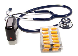 Image showing stethoscope, tablets  and doctor seal isolated on white backgrou