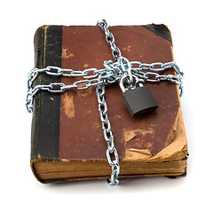 Image showing tattered book with chain and padlock isolated on white backgroun