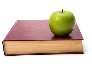 Image showing book with apple isolated on white background 
