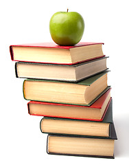 Image showing book stack with apple isolated on white background 