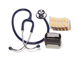 Image showing stethoscope, tablets  and doctor seal isolated on white backgrou