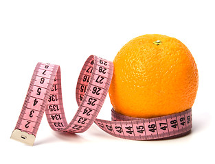 Image showing  tape measure wrapped around the orange isolated on white backgr