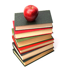 Image showing book stack with apple isolated on white background 