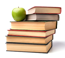 Image showing book stack with apple isolated on white background 