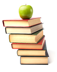 Image showing book stack with apple isolated on white background 