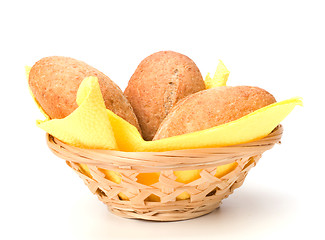 Image showing fresh warm rolls in breadbasket isolated on white background