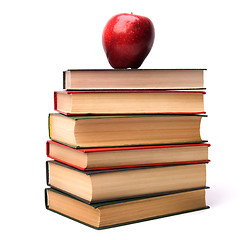 Image showing book stack with apple isolated on white background 