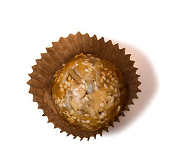 Image showing Caramel sweets with sunflower seeds isolated on white 