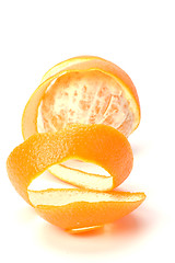 Image showing orange with peeled spiral skin isolated on white background