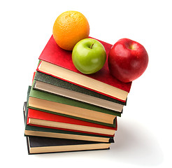 Image showing book stack with fruits isolated on white background 