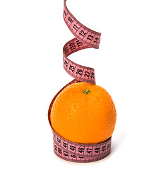 Image showing  tape measure wrapped around the orange isolated on white backgr