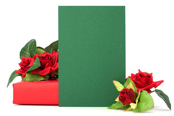 Image showing Gift with floral decor. Flowers are artificial. 