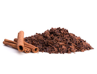 Image showing grated chocolate and cinnamon isolated on white background